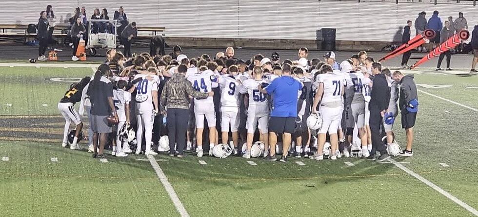 Gatesville and Robinson players and coaches unite in prayer for Trevor Gerik.