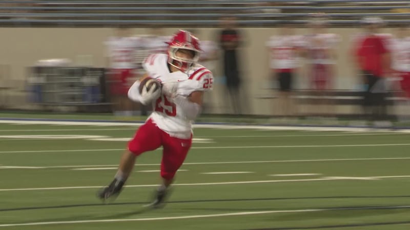 Belton's Gino Zecca rushes for a touchdown in a game against University.