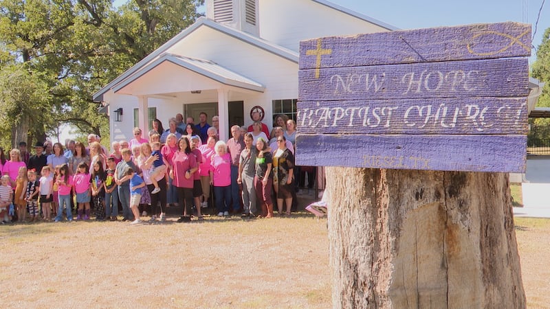 The New Hope Baptist Church congregation gathers in from of the sanctuary to take a photograph...