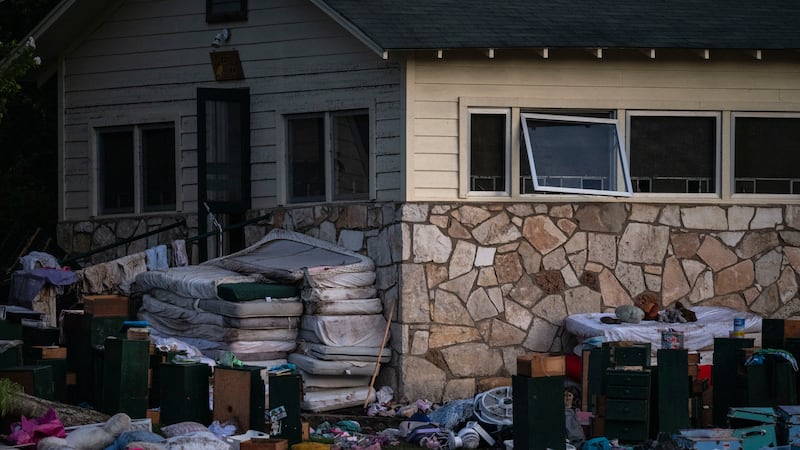 Camper's belongings sit outside one of Camp Mystic's cabins near the Guadalupe River, Monday,...