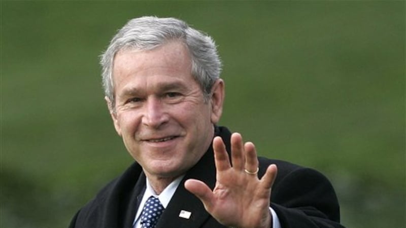 FILE-- In a Jan. 25, 2007 file photo President George W. Bush waves as he departs the White...
