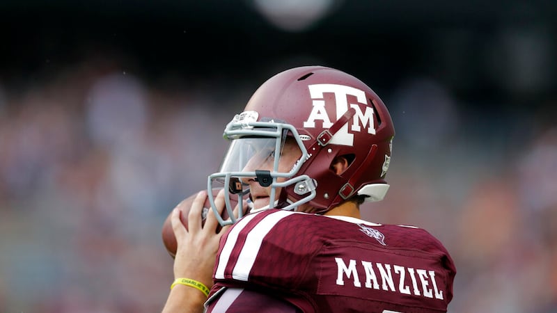 Texas A&M quarterback Johnny Manziel throws a pass before an NCAA college football game...
