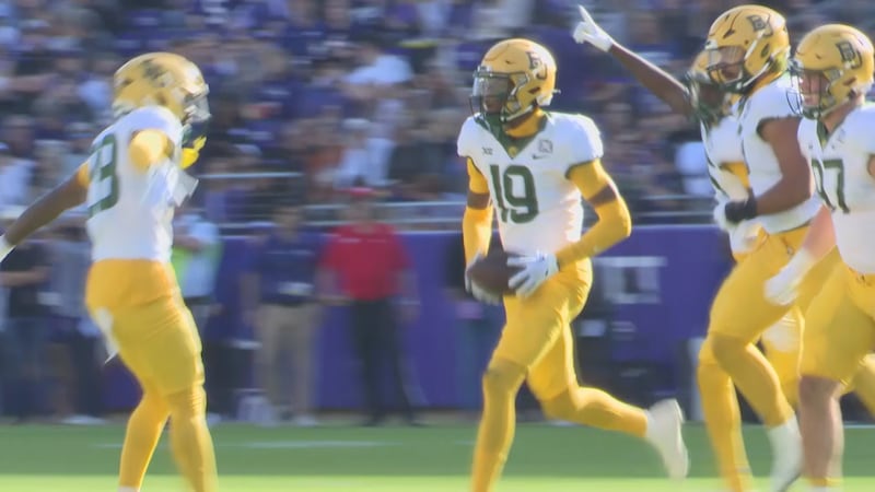 Jenkins recovers a fumble during the TCU game in 2023.