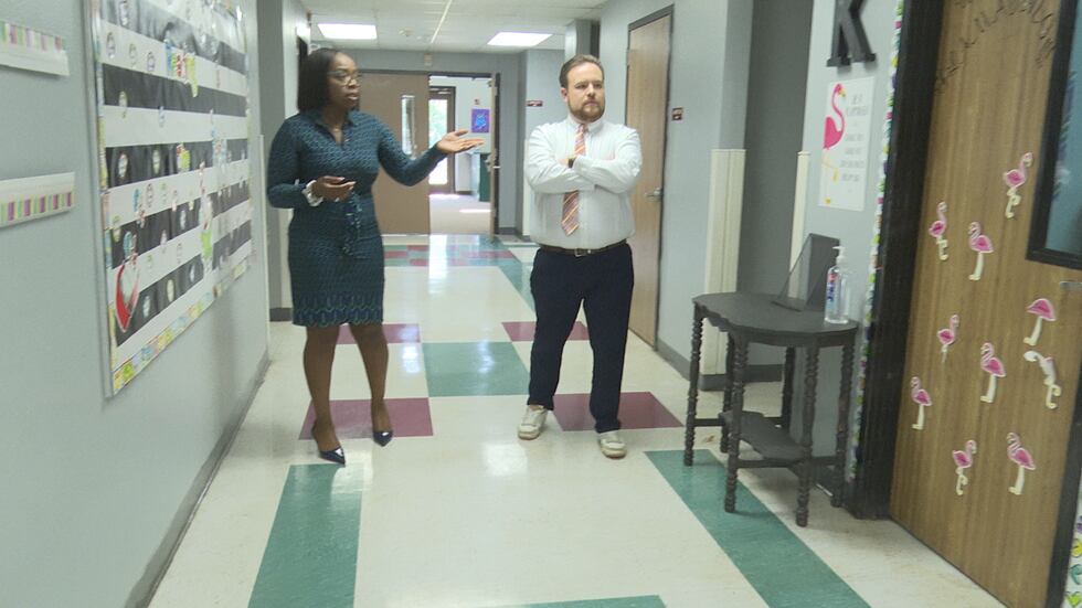 Dr. Remy Godfrey walking the walls at Buckholts ISD showcasing the halls and infrastructure at...